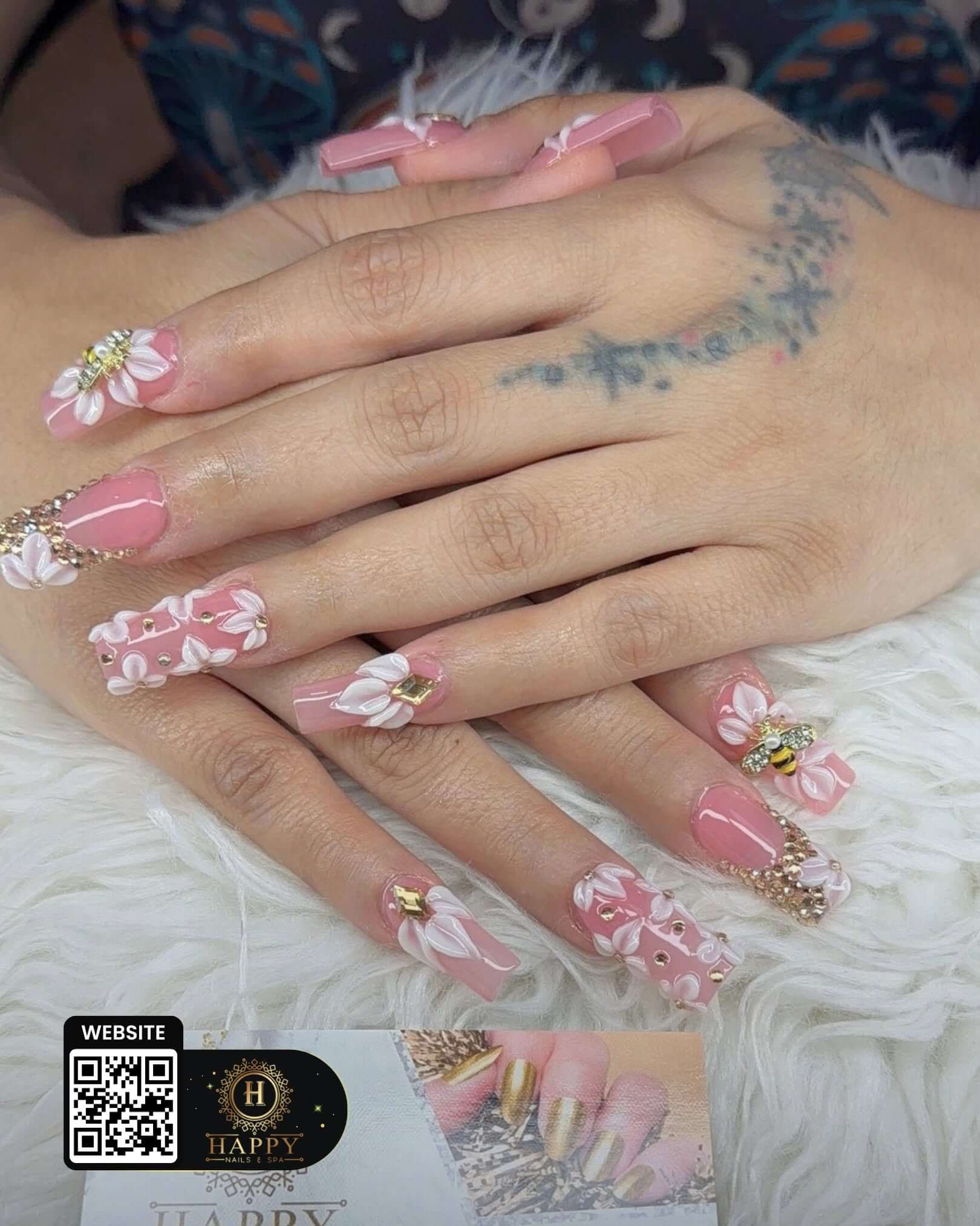 Pink floral nail design from Happy Nail & Spa