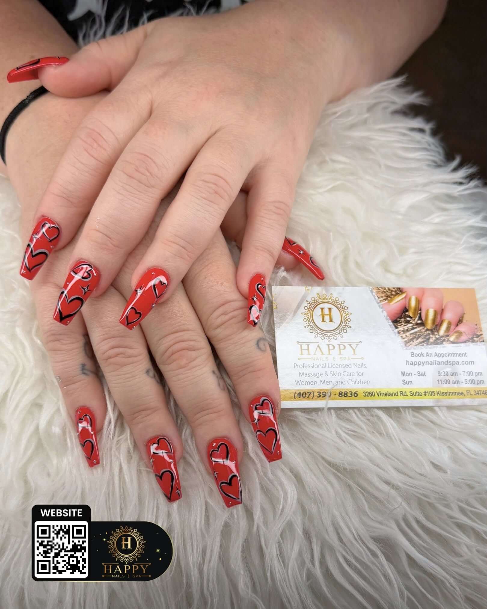 Red manicure with decorative details